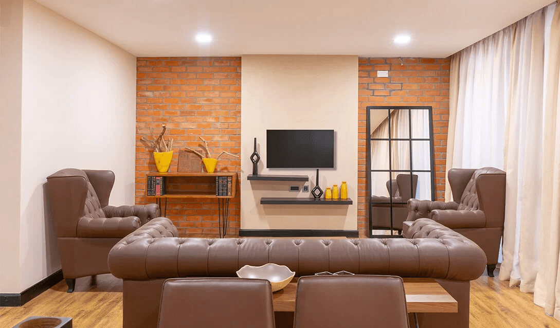 2-bedroom 2-bathroom apartment bedroom with wood flooring in Kampala, Uganda